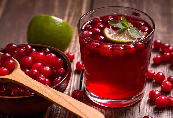 glass-of-cranberry-juice-near-bowl-of-and-spoon